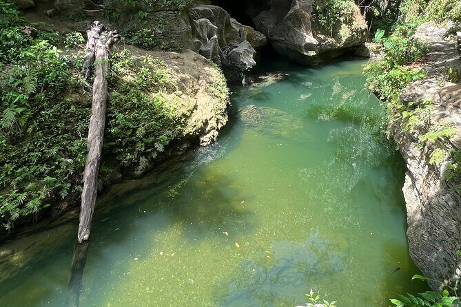 Cave Adventure: Canyon and Hidden Waterfall in Charco Azul - Cave time in Cuevas Arenales: swimming, lights, and three cave stops