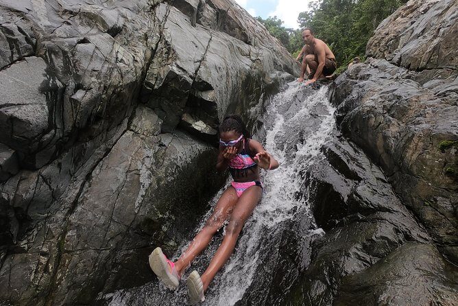 Half-Day Yunque Rainforest Waterslide & rope swing Guided Tour - Stop 2: natural rock waterslide and the cliff jump payoff