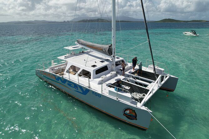 Icacos: Luxury Sailing Catamaran All Inclusive Beach and Snorkel - Deck time with water slides, swings, and water mats