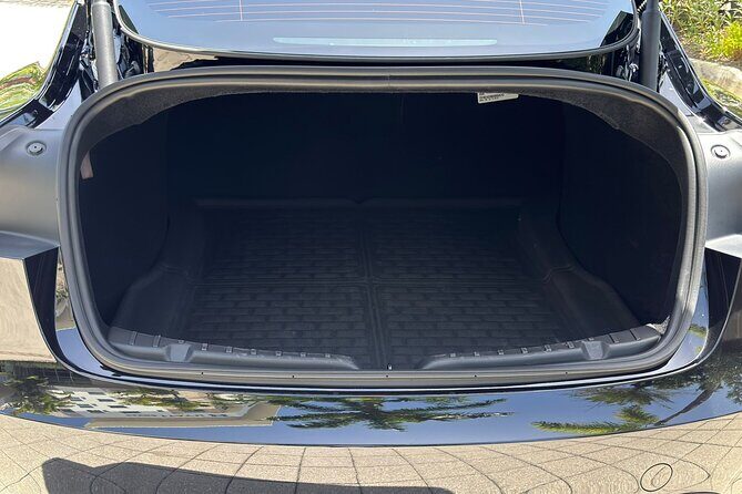 Puerto Rico Island Wide Private Transfers, Tesla 3 Luxury Sedan. - Bottled water and the little things that signal service level