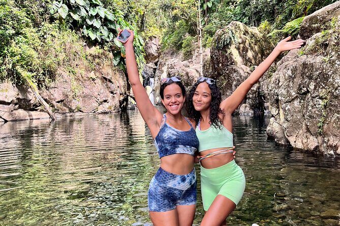 Small-Group El Yunque Waterslide Adventure & transportation - El Yunque National Forest: jungle hike, waterslide thrills, rope swing