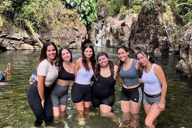 Small-Group El Yunque Waterslide Adventure & transportation - Rio Fajardo water play: sliding, walking in the river, and cliff-jump options