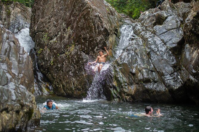 Top Rated El Yunque Rainforest & Waterslide – SmallGroup Tour - First stop: waterfall hike, rope swing, and water-from-multiple-heights